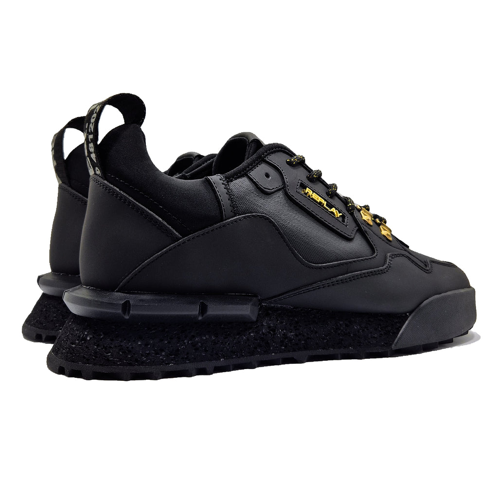 Black sneakers with a brand logo on a white background